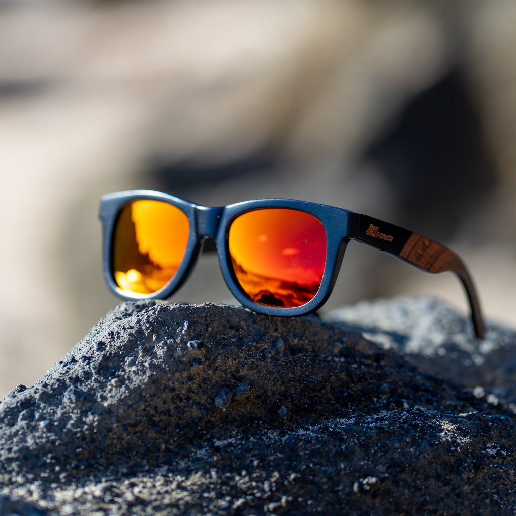 black sunglasses with red mirror polarized lens