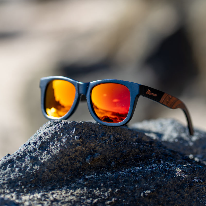 black sunglasses with red mirror polarized lens